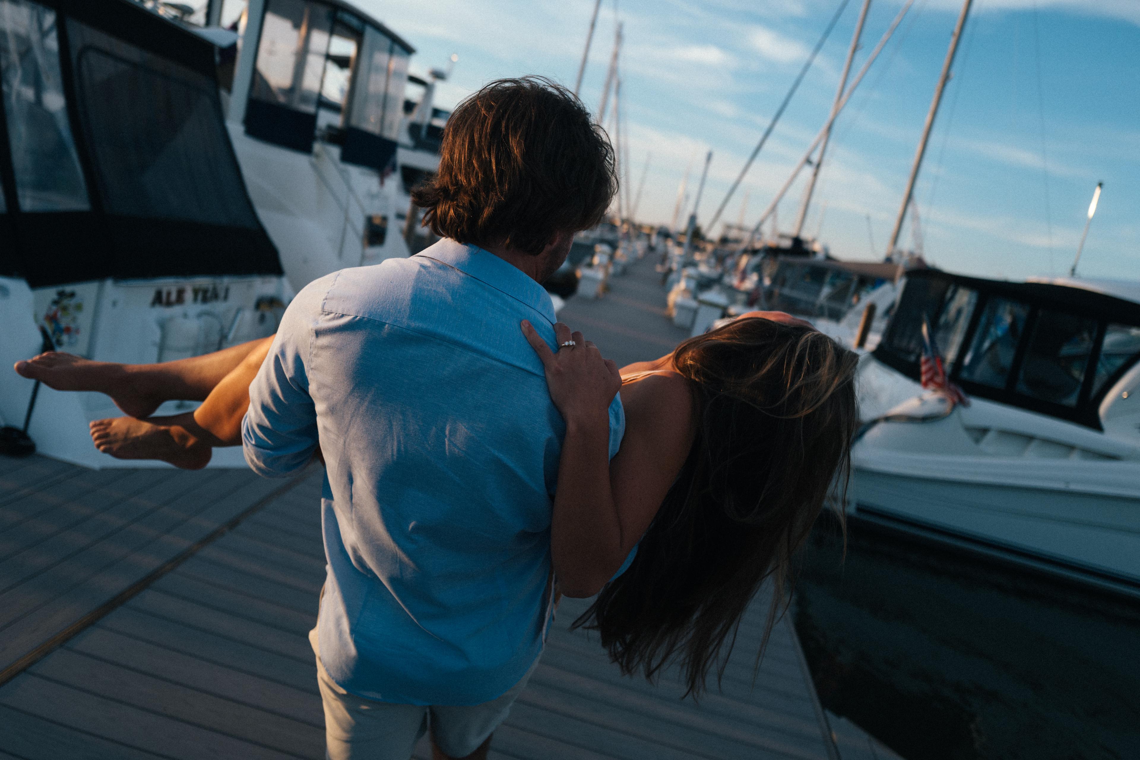 Harry holding Lauren on the dock